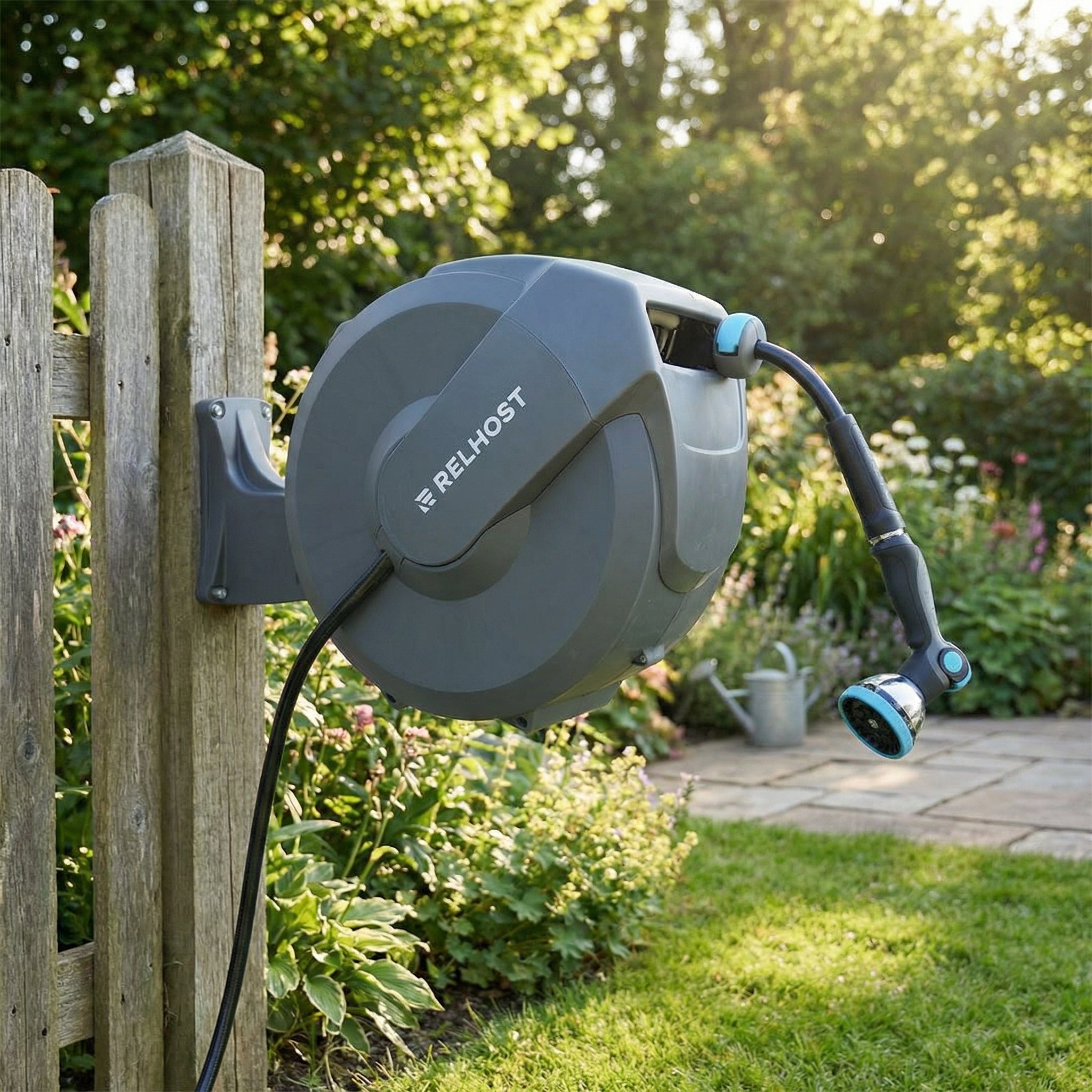Relhost retractable garden hose reel wall mounted on wooden fence in garden setting